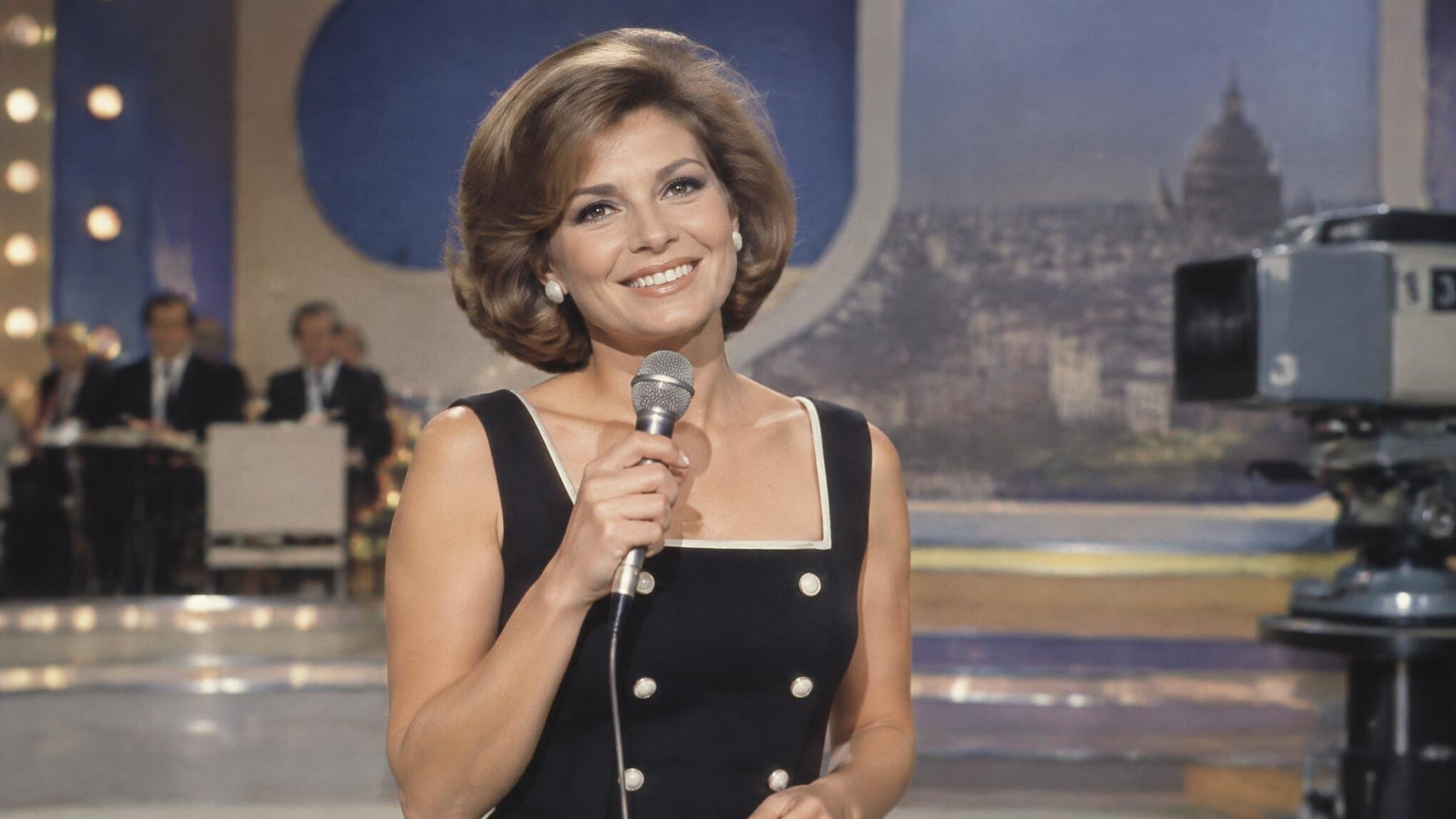 french tv presenter on stage