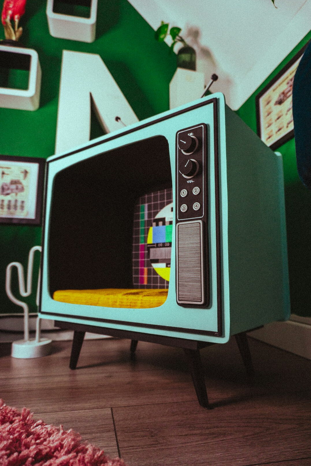 Vintage television set glowing in a dim living room